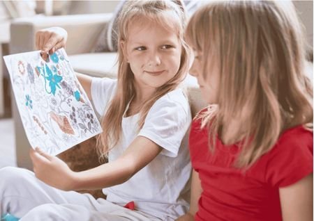 girl showing drawing
